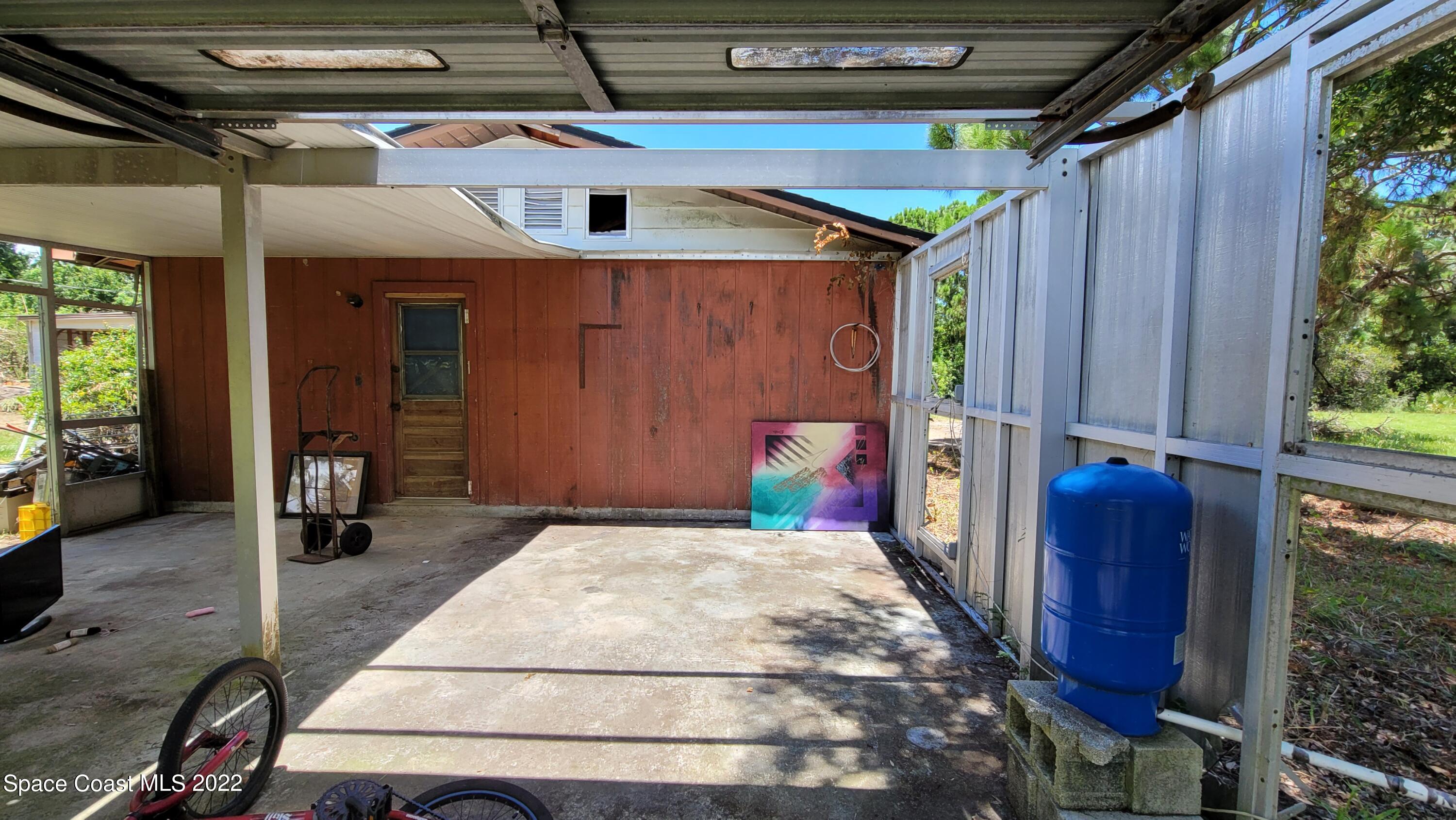 1910 Atz Road Malabar, FL 32950 - Photo 7 of 58 a backyard of a house with seating space