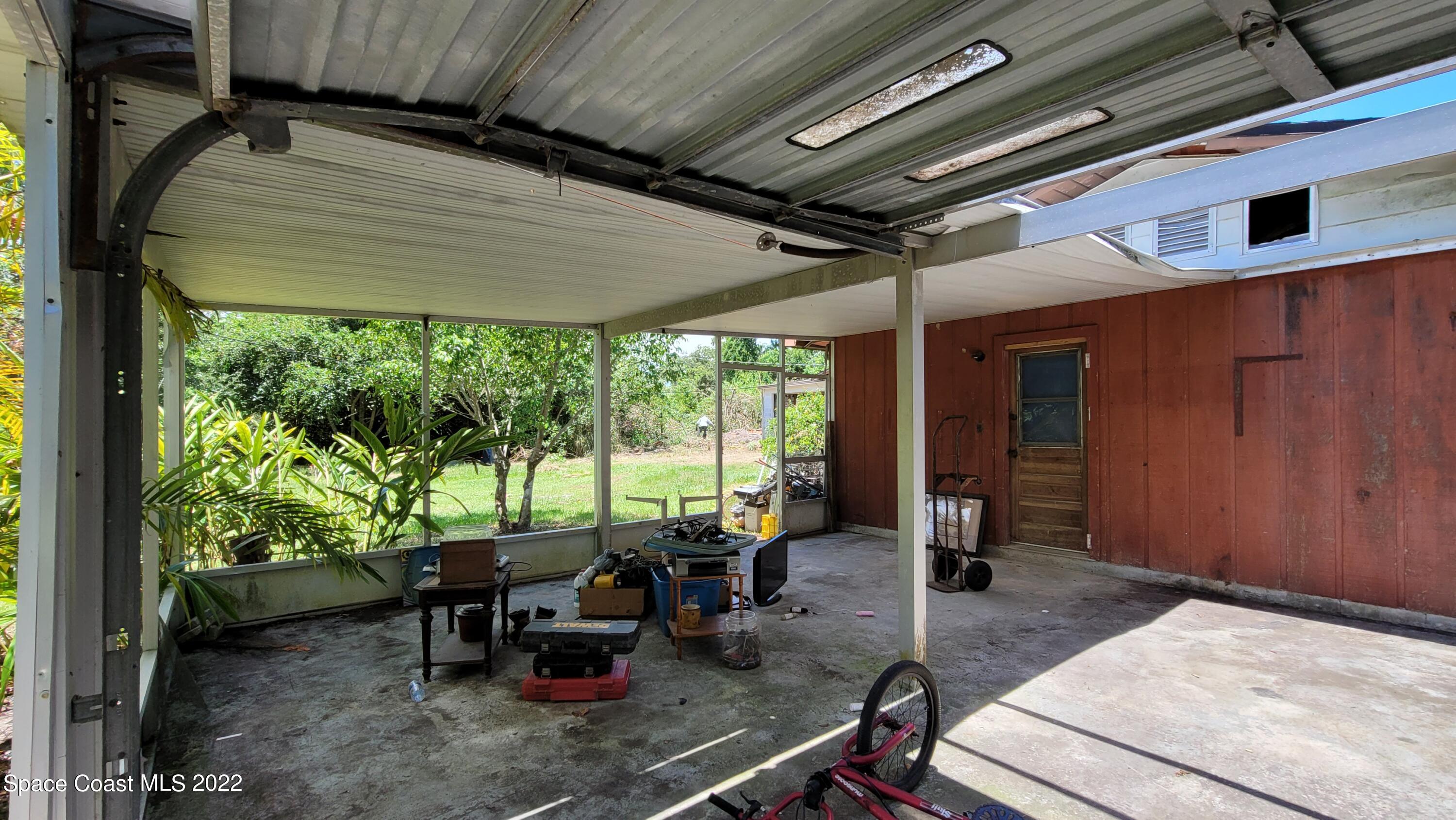 1910 Atz Road Malabar, FL 32950 - Photo 8 of 58 a dining room with furniture and floor to ceiling window