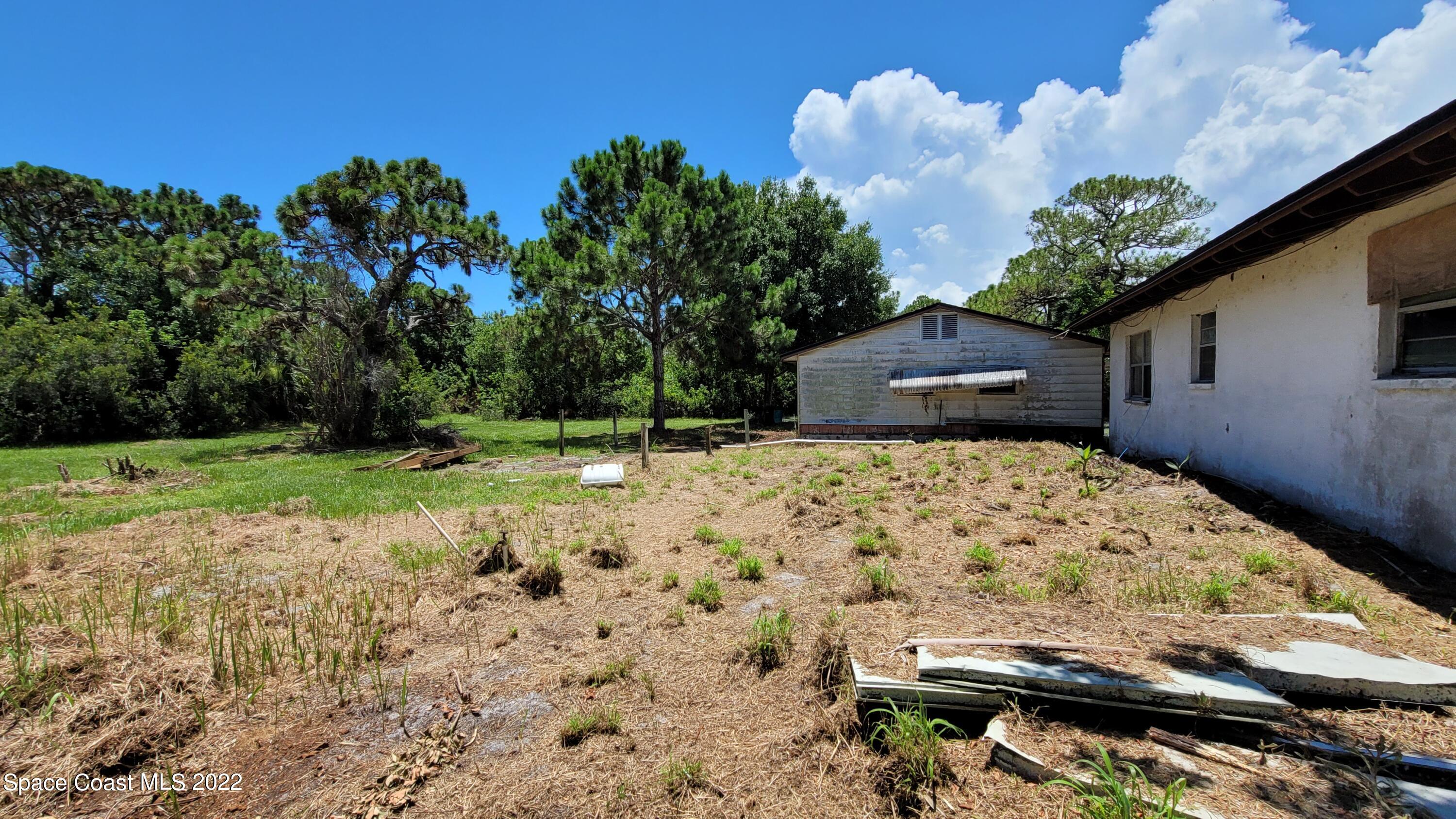 1910 Atz Road Malabar, FL 32950 - Photo 9 of 58 a view of backyard with a garden and entertaining space