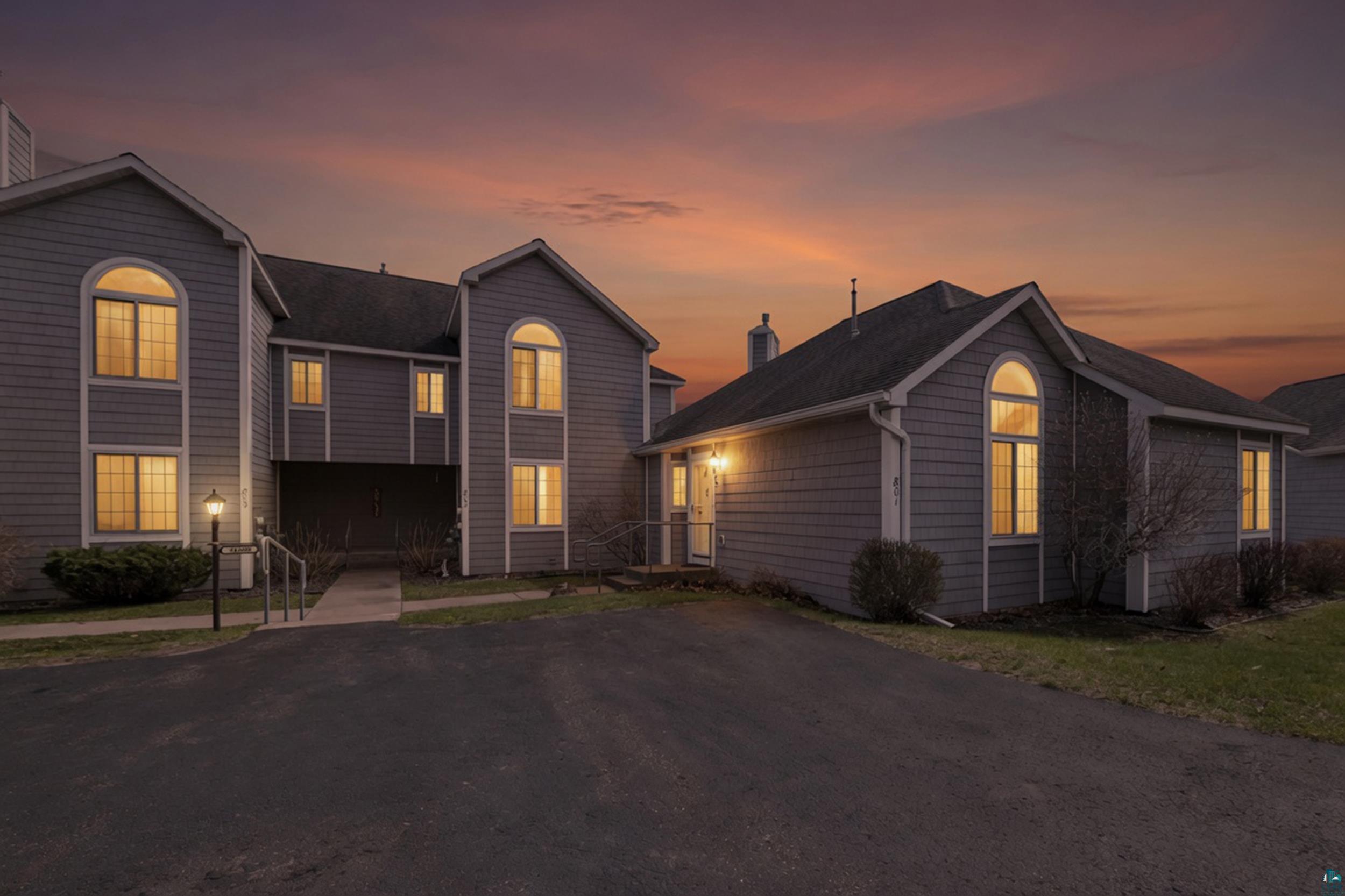 34590 Bay View Road, Unit 801 Bayfield, WI 54814 - Photo 35 of 36 Shingle-sided exterior featuring architectural arched windows, a private entrance, and exterior lighting