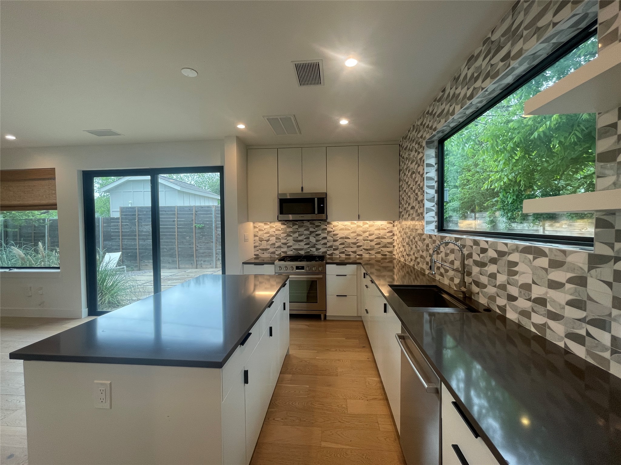 4604 South 2nd Street, Unit 2 Austin, TX 78745 - Photo 11 of 35 Kitchen location offers easy access to al fresco dining.