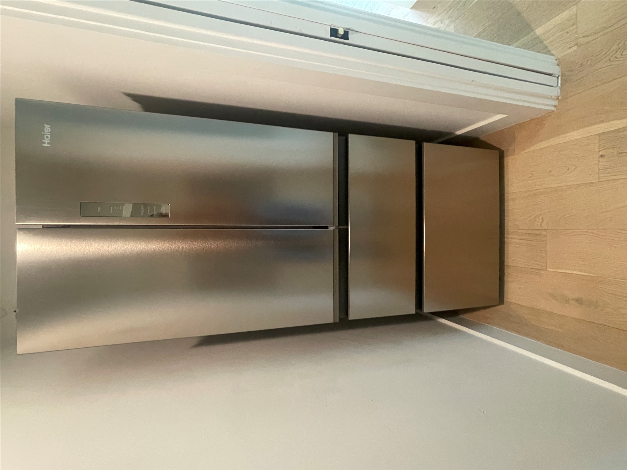 4604 South 2nd Street, Unit 2 Austin, TX 78745 - Photo 14 of 35 Stainless steel Haier refrigerator with a bottom freezer drawer and French doors