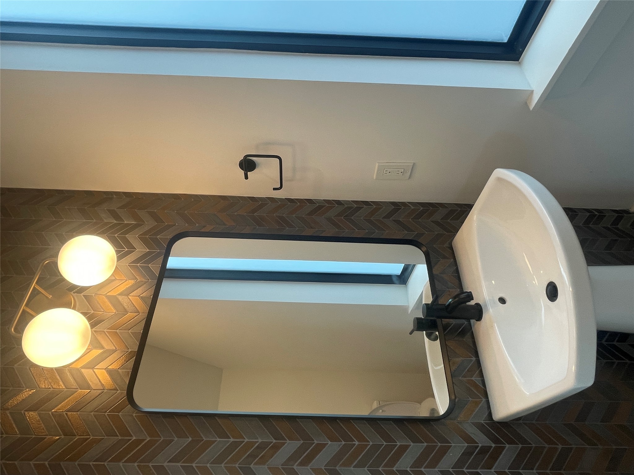 4604 South 2nd Street, Unit 2 Austin, TX 78745 - Photo 16 of 35 The Metallic Lava Chevron Basalt Mosaic tile in the downstairs powder bath makes a statement!