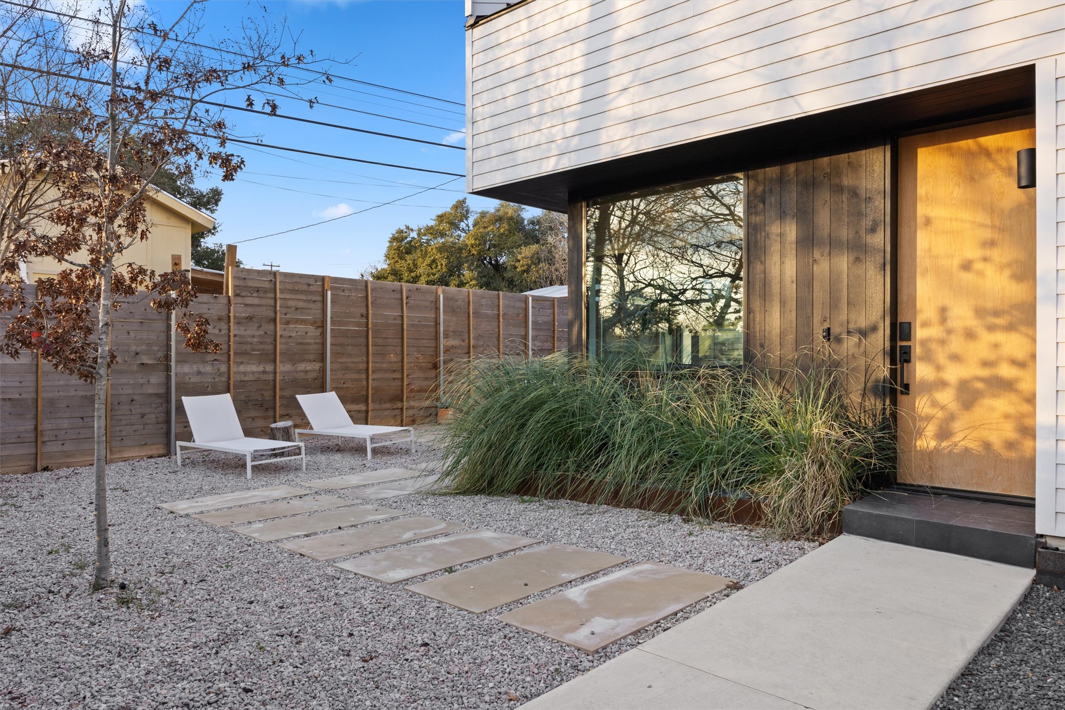 4604 South 2nd Street, Unit 2 Austin, TX 78745 - Photo 3 of 35 Private wood fence, oversized limestone pavers and rock add to the modern design.