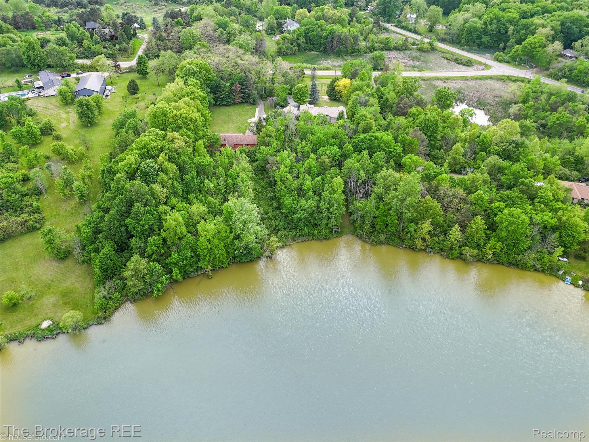 1077 Hadley Road Lapeer, MI 48446 - Photo 60 of 61 Waterfront property with extensive tree coverage and a private pond