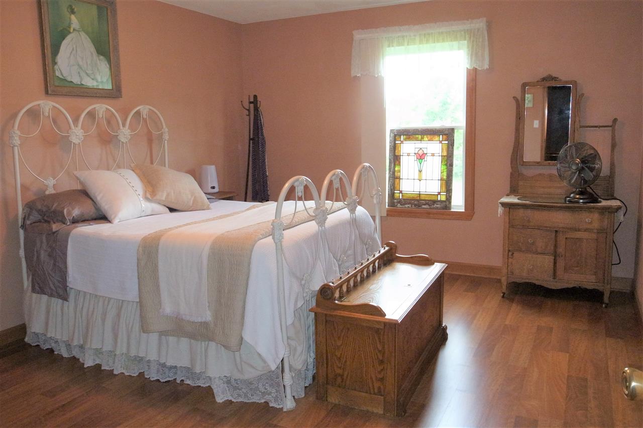 10192 Metalmark Lane, Unit 4 Roscoe, IL 61073 - Photo 6 of 16 a bedroom with bed and window