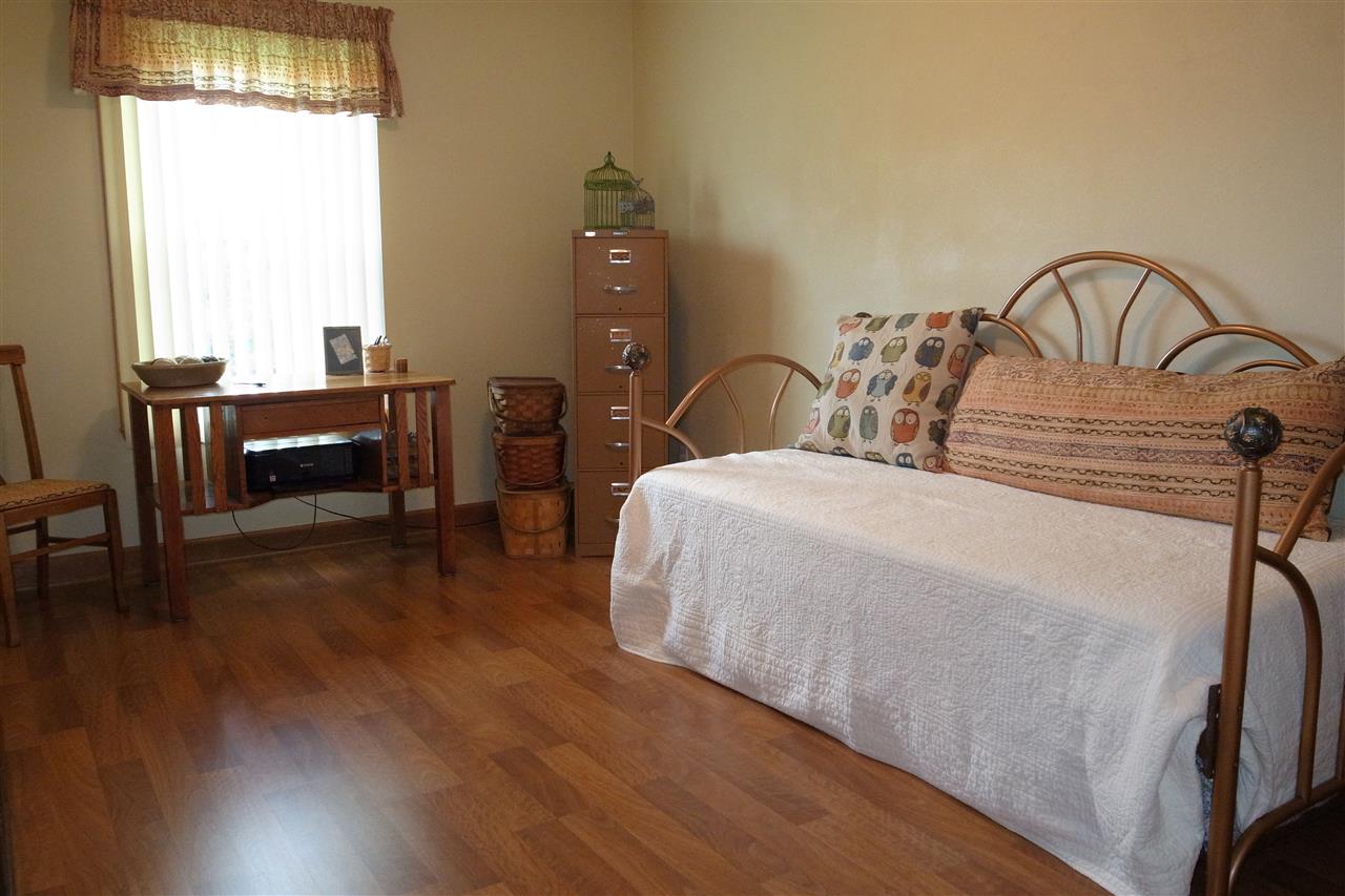 10192 Metalmark Lane, Unit 4 Roscoe, IL 61073 - Photo 7 of 16 a bedroom with bed and a window