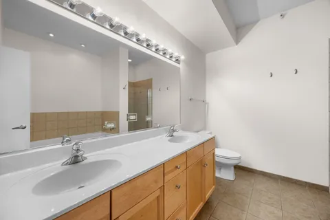 a bathroom with a sink and a large mirror