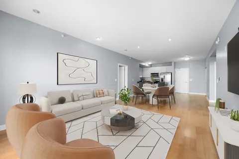 a living room with furniture and a table