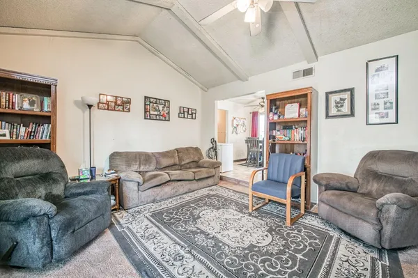a living room with furniture and a couch