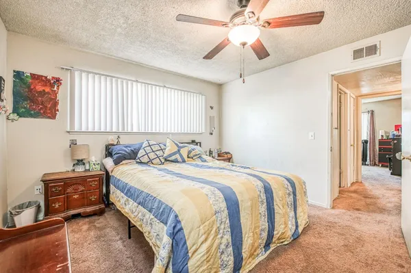 a bedroom with bed and window