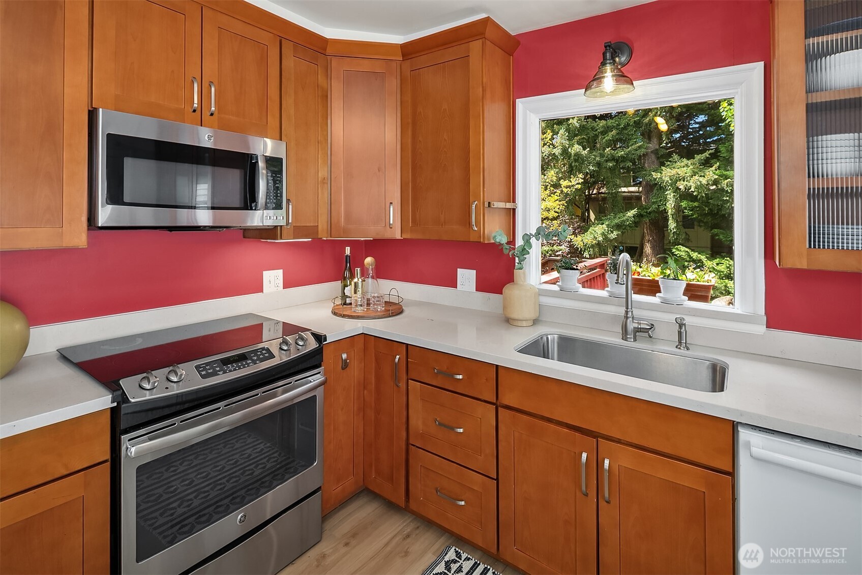 3917 Interlake Avenue North Seattle, WA 98103 - Photo 11 of 36 a kitchen with a sink stove and microwave