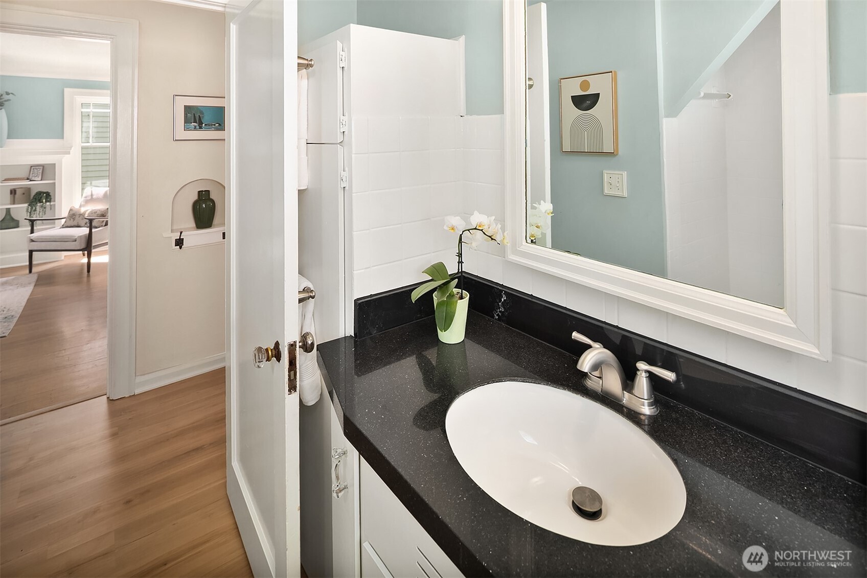 3917 Interlake Avenue North Seattle, WA 98103 - Photo 15 of 36 a bathroom with a sink and mirror