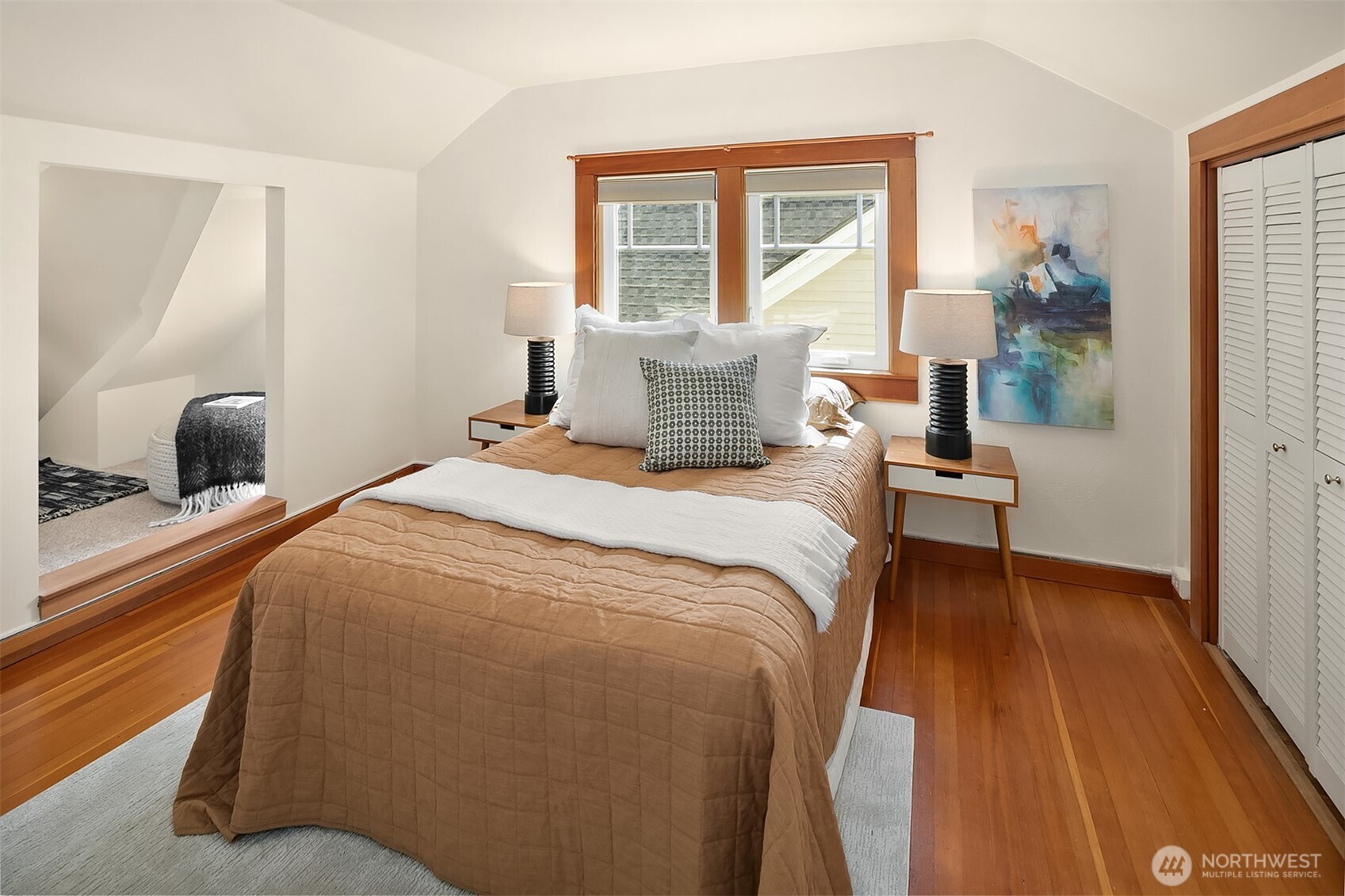 3917 Interlake Avenue North Seattle, WA 98103 - Photo 19 of 36 a bedroom with a bed and wooden floor