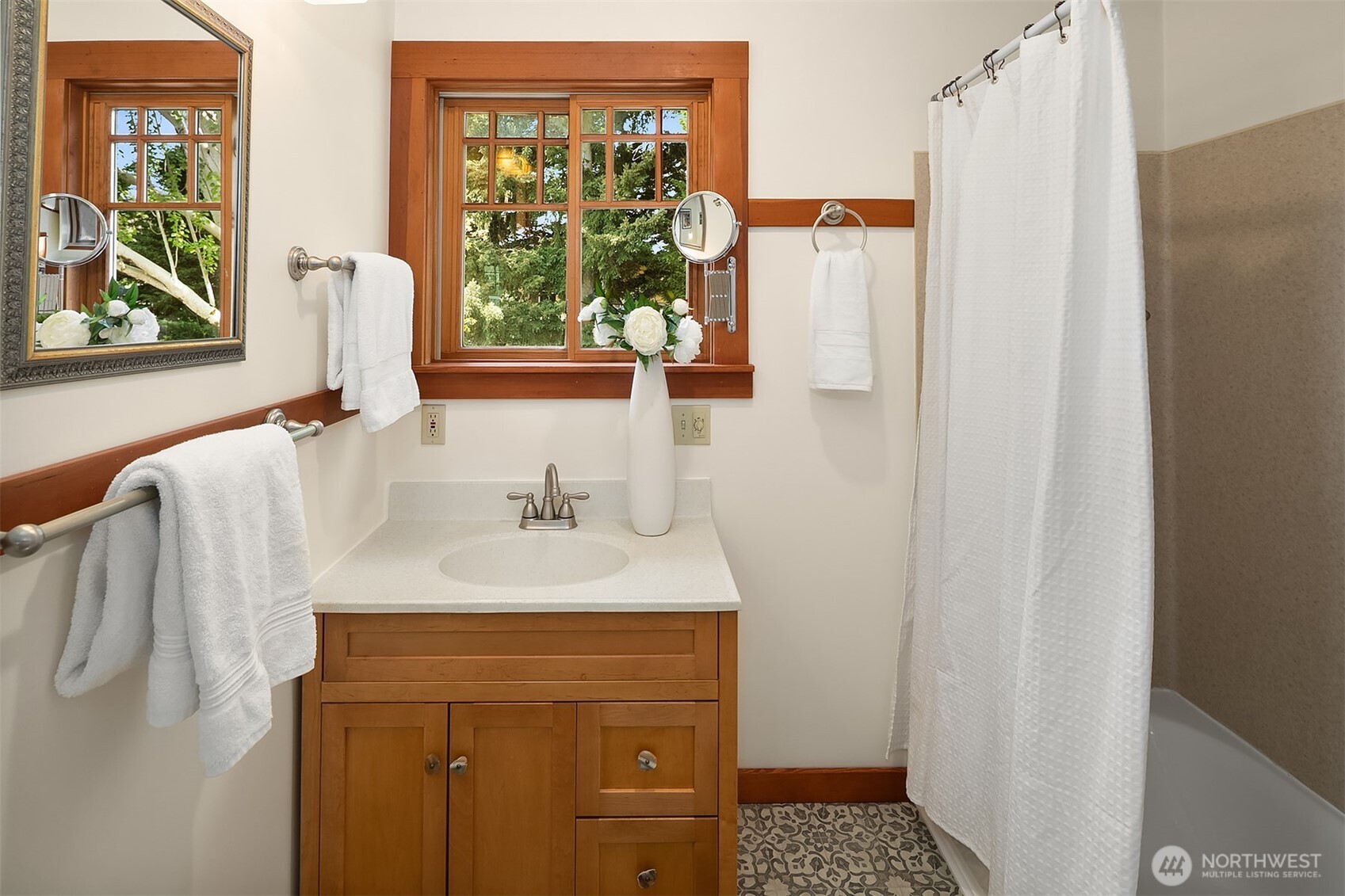 3917 Interlake Avenue North Seattle, WA 98103 - Photo 21 of 36 a bathroom with a sink and a mirror