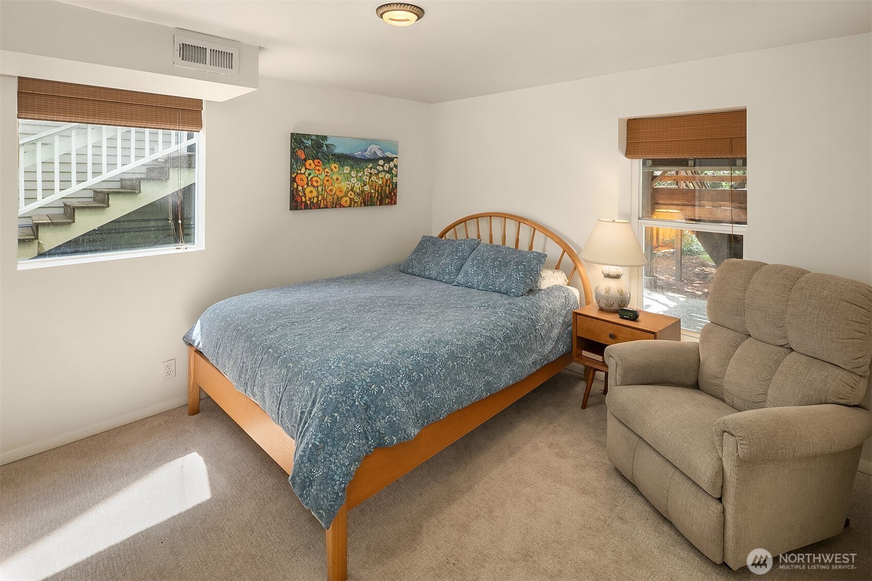 3917 Interlake Avenue North Seattle, WA 98103 - Photo 26 of 36 a bedroom with a bed couch and window