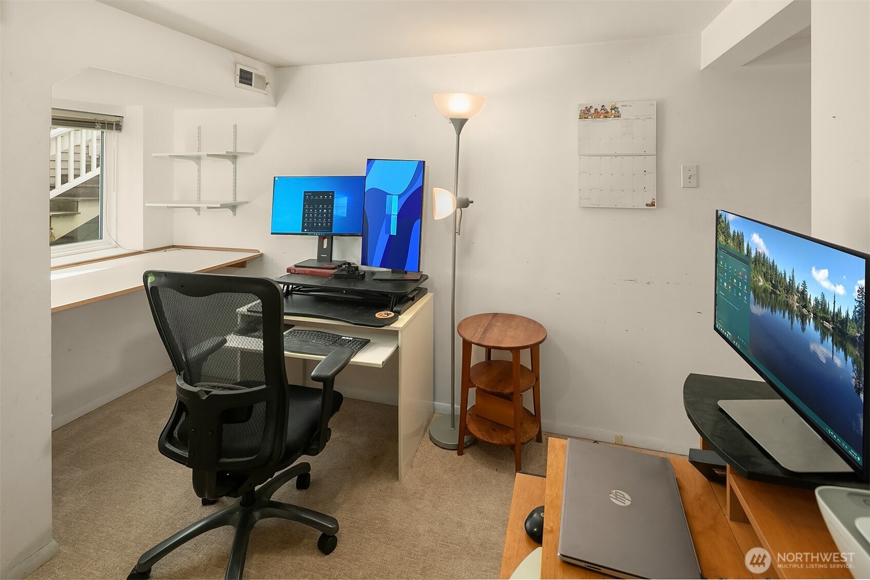 3917 Interlake Avenue North Seattle, WA 98103 - Photo 27 of 36 a view of a workspace with furniture and a window