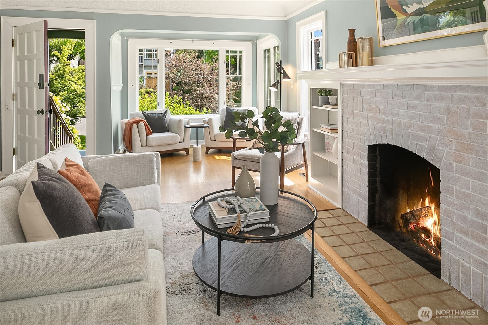 3917 Interlake Avenue North Seattle, WA 98103 - Photo 5 of 36 a living room with furniture a fireplace and a large window