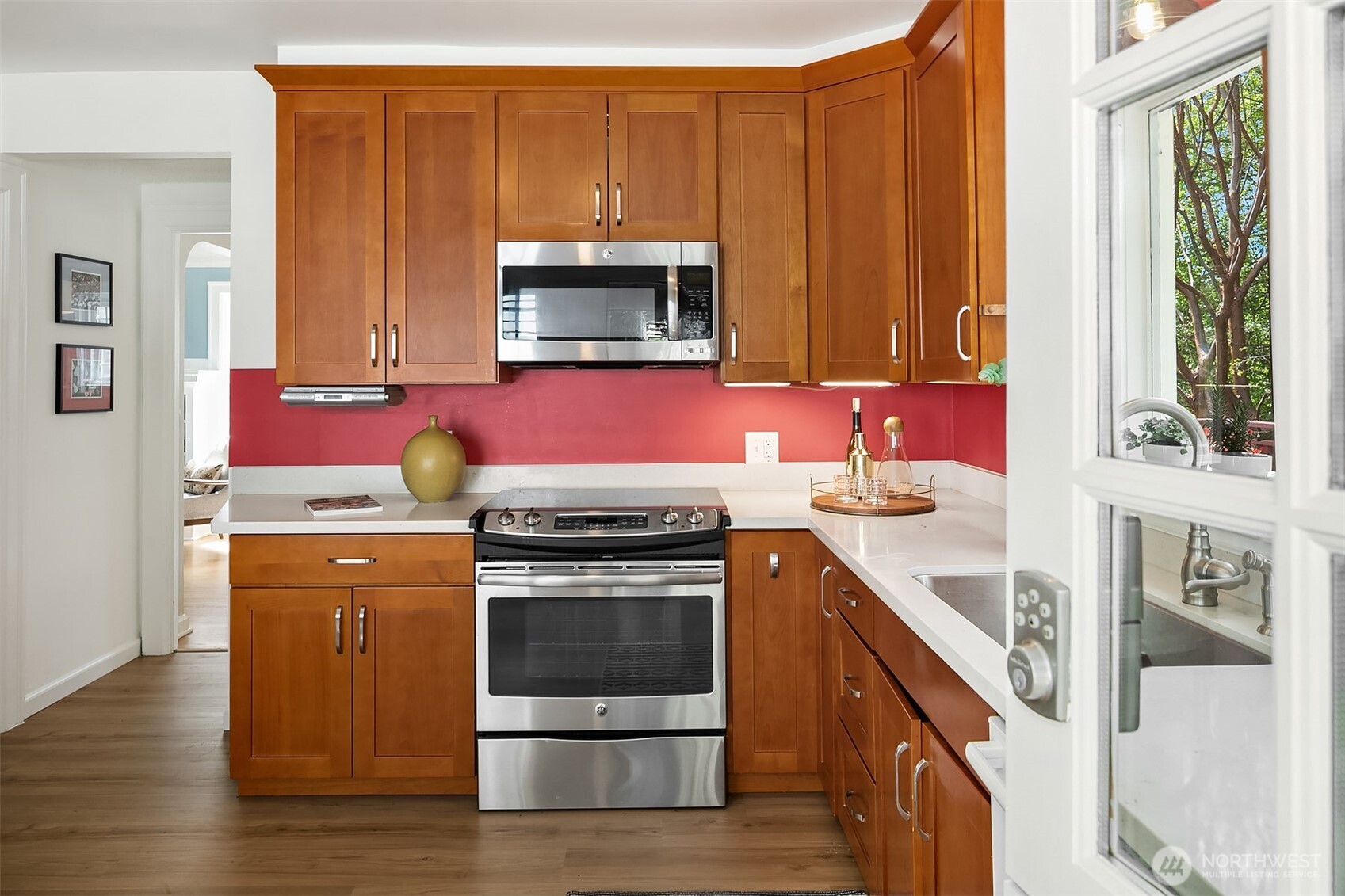 3917 Interlake Avenue North Seattle, WA 98103 - Photo 10 of 36 a kitchen with a stove microwave and sink