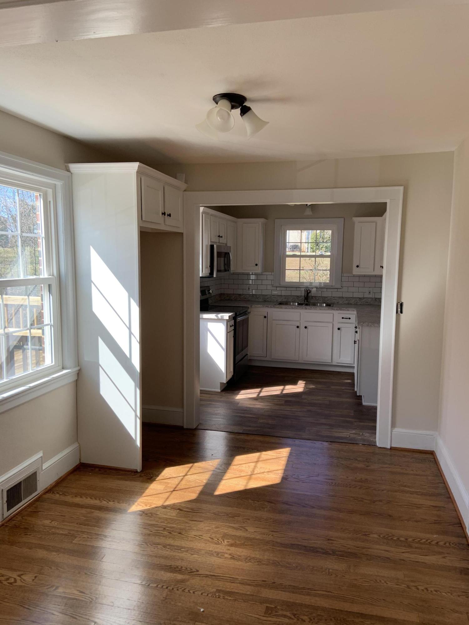 4004 Cove Road Roanoke, VA 24017 - Photo 14 of 30 a kitchen with stainless steel appliances granite countertop a refrigerator stove top oven and cabinets