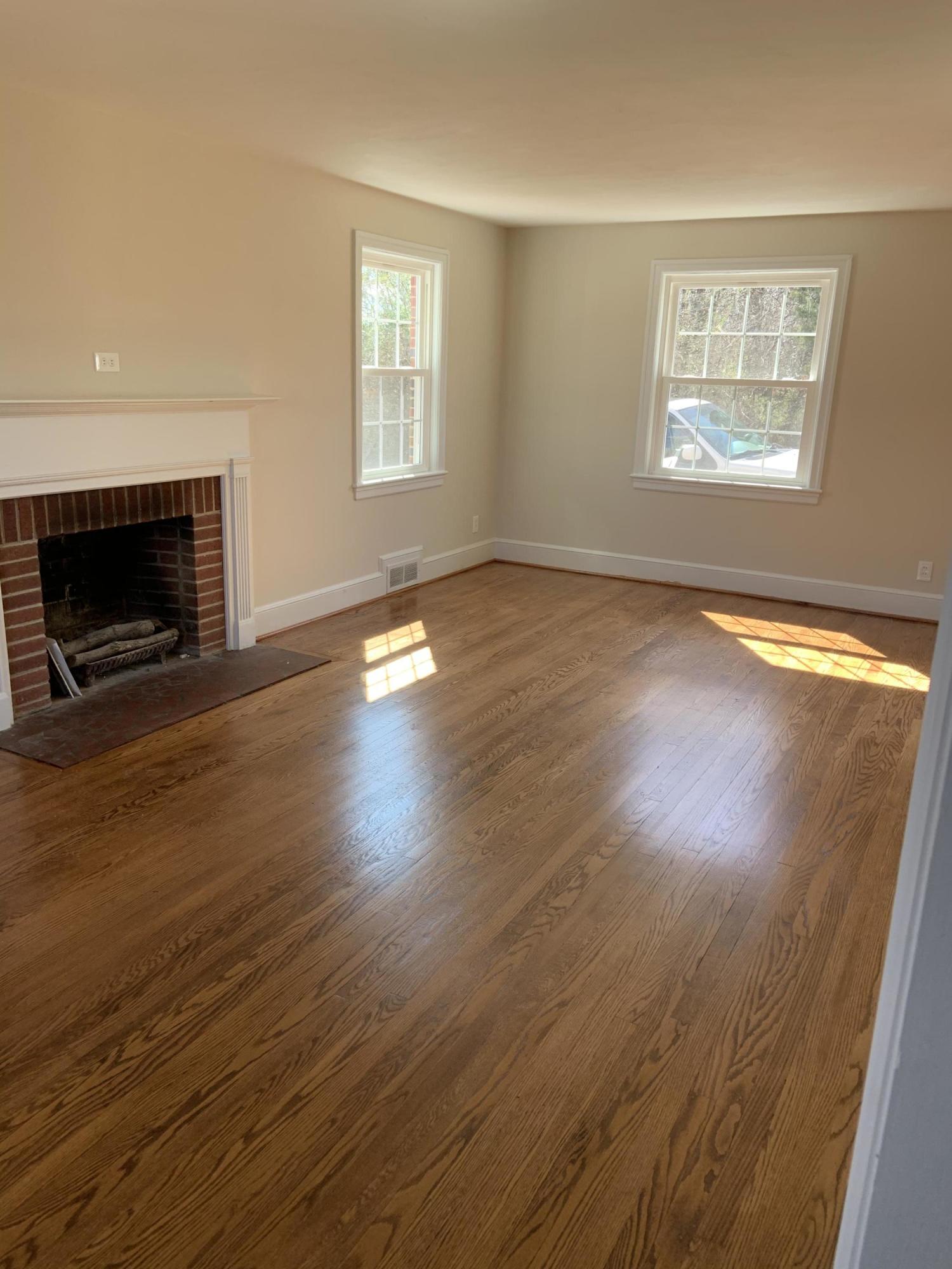 4004 Cove Road Roanoke, VA 24017 - Photo 17 of 30 an empty room with wooden floor fireplace and windows