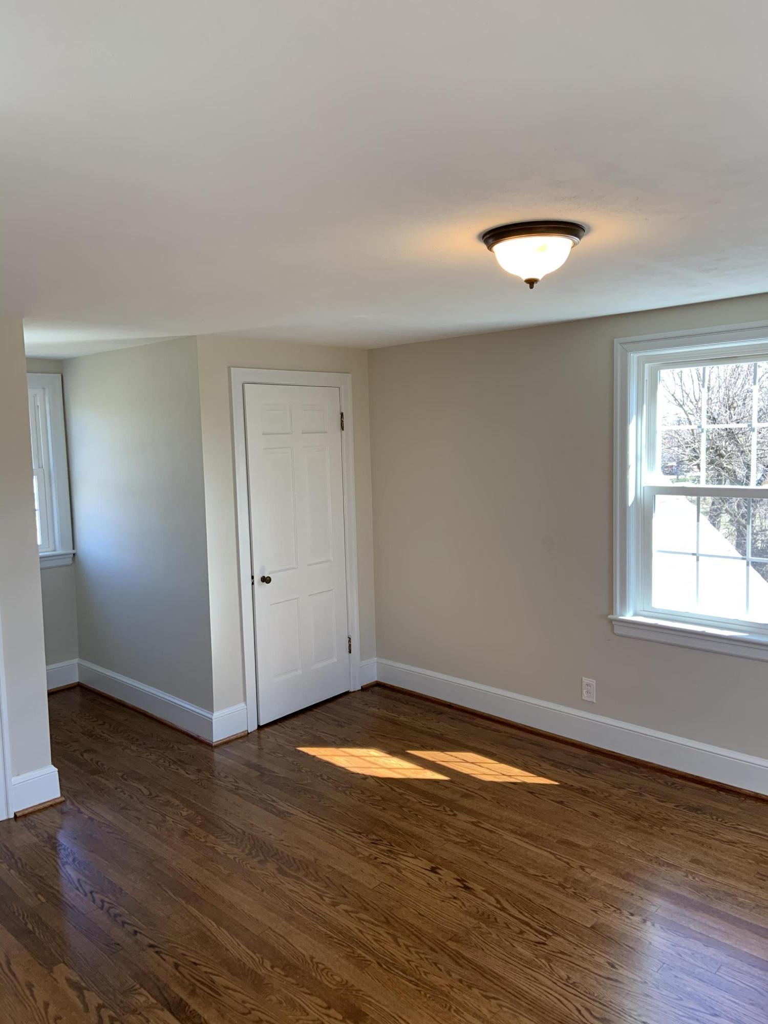 4004 Cove Road Roanoke, VA 24017 - Photo 25 of 30 an empty room with wooden floor and windows