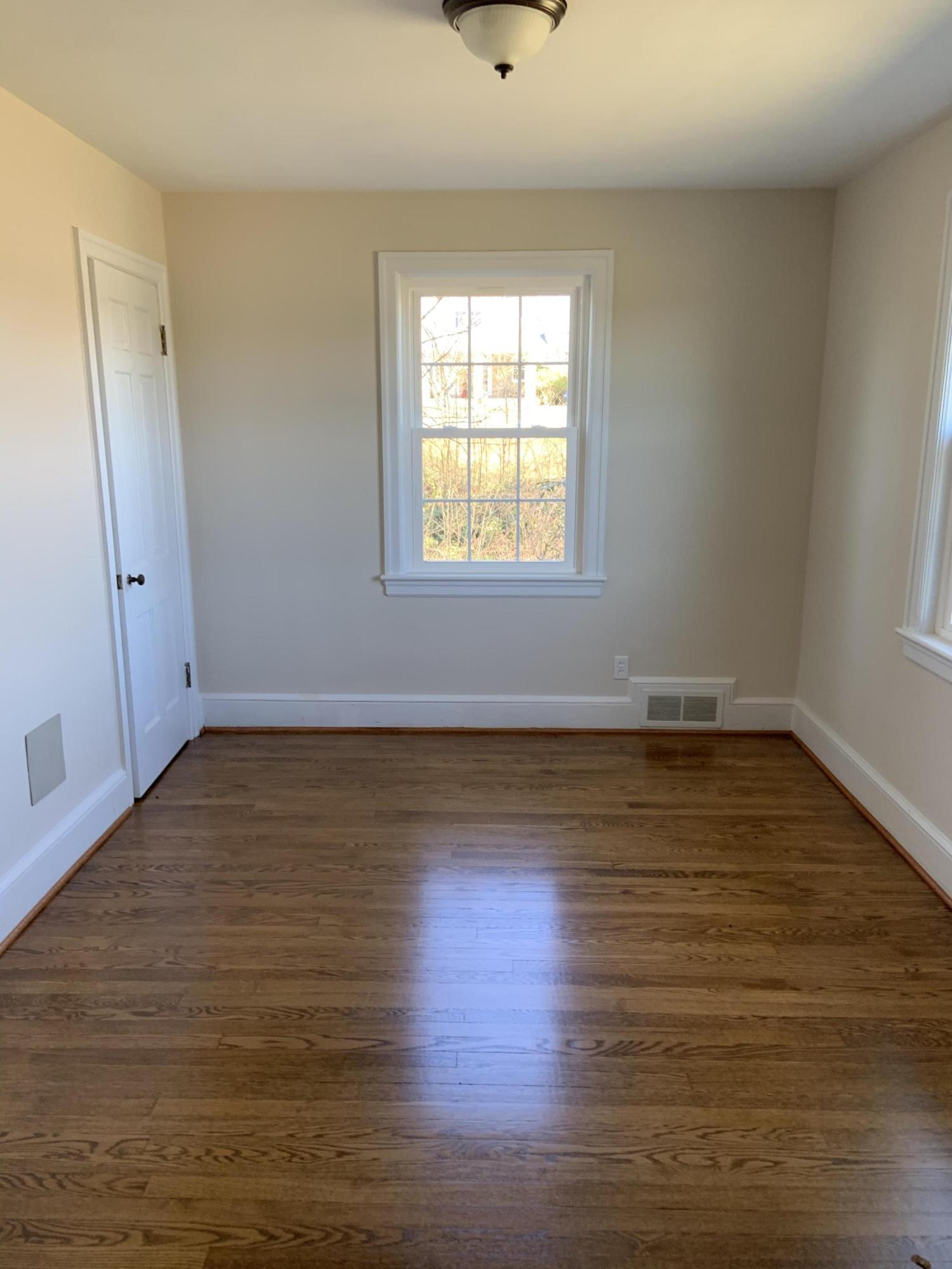 4004 Cove Road Roanoke, VA 24017 - Photo 27 of 30 a view of an empty room with wooden floor and a window