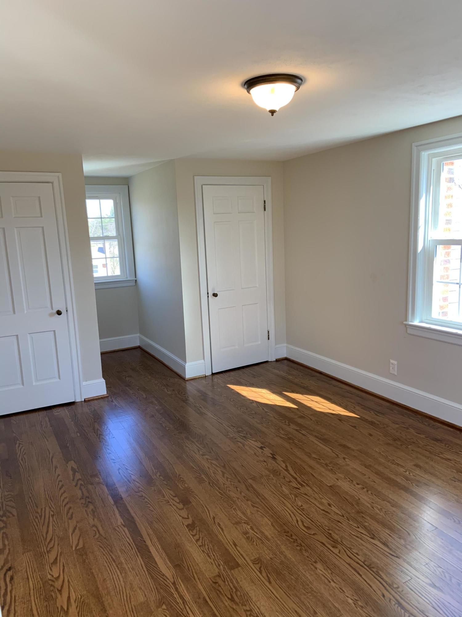 4004 Cove Road Roanoke, VA 24017 - Photo 28 of 30 an empty room with wooden floor and windows
