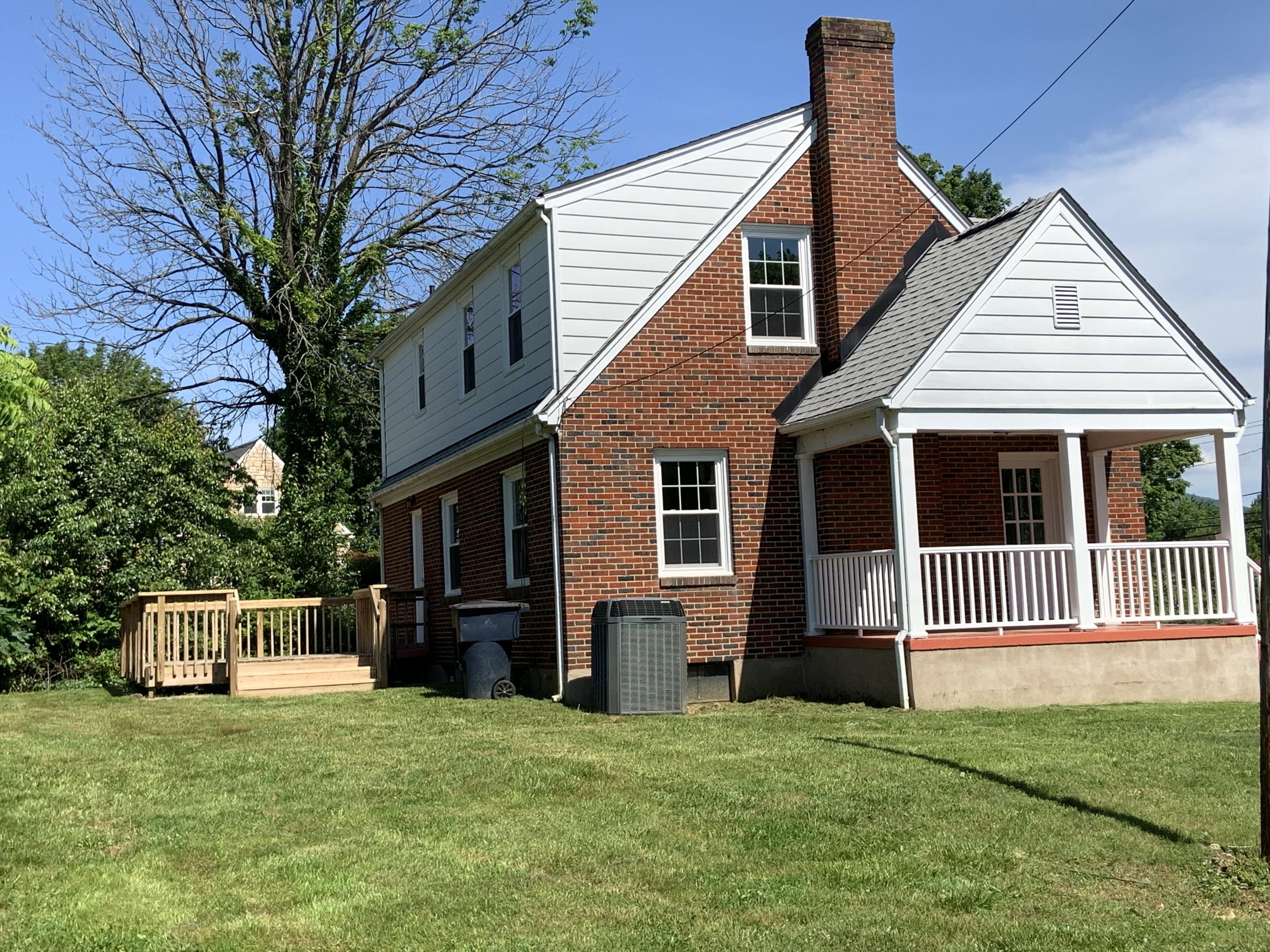 4004 Cove Road Roanoke, VA 24017 - Photo 5 of 30 a front view of a house with a garden