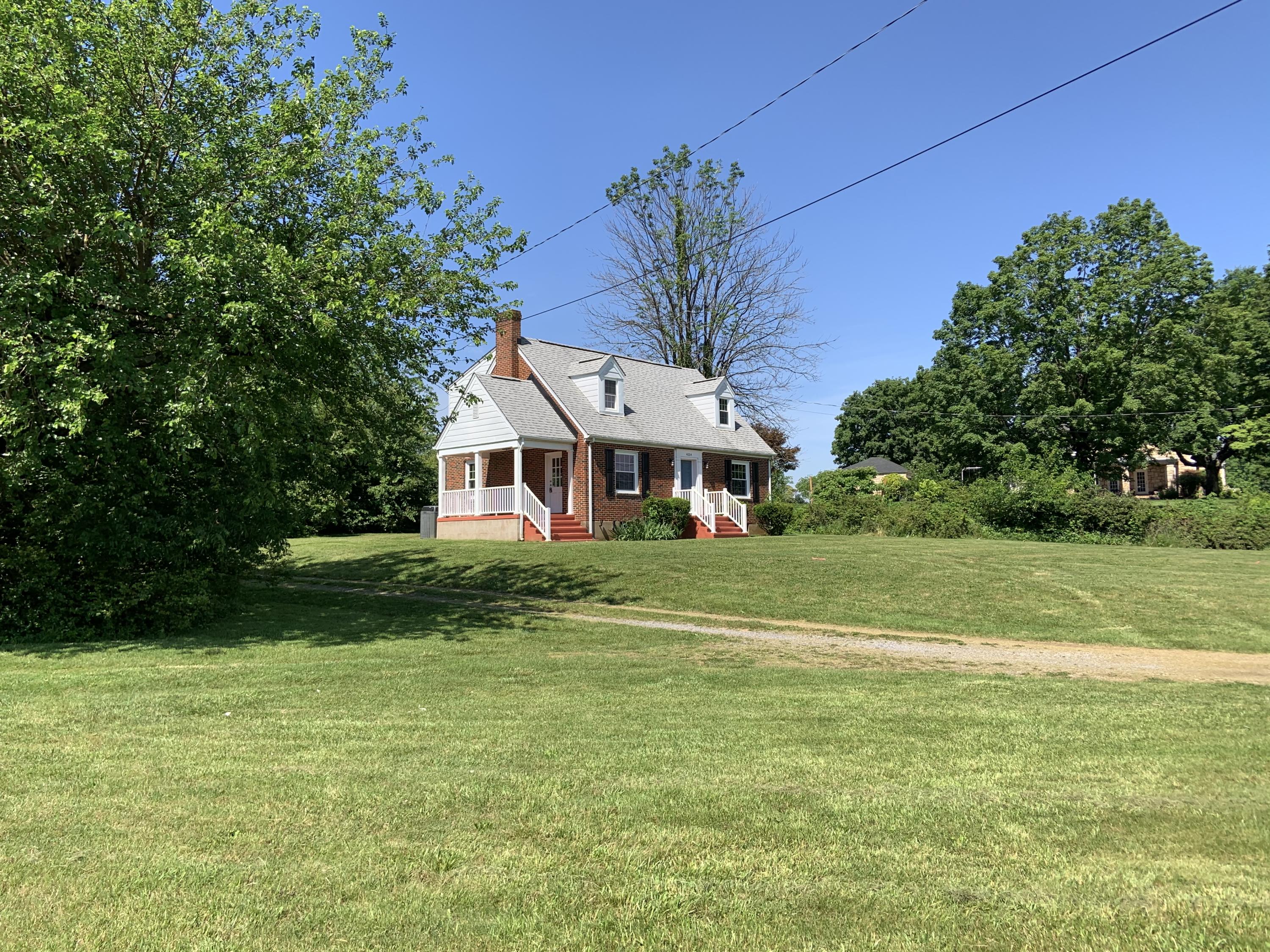 4004 Cove Road Roanoke, VA 24017 - Photo 6 of 30 a front view of a house with a yard