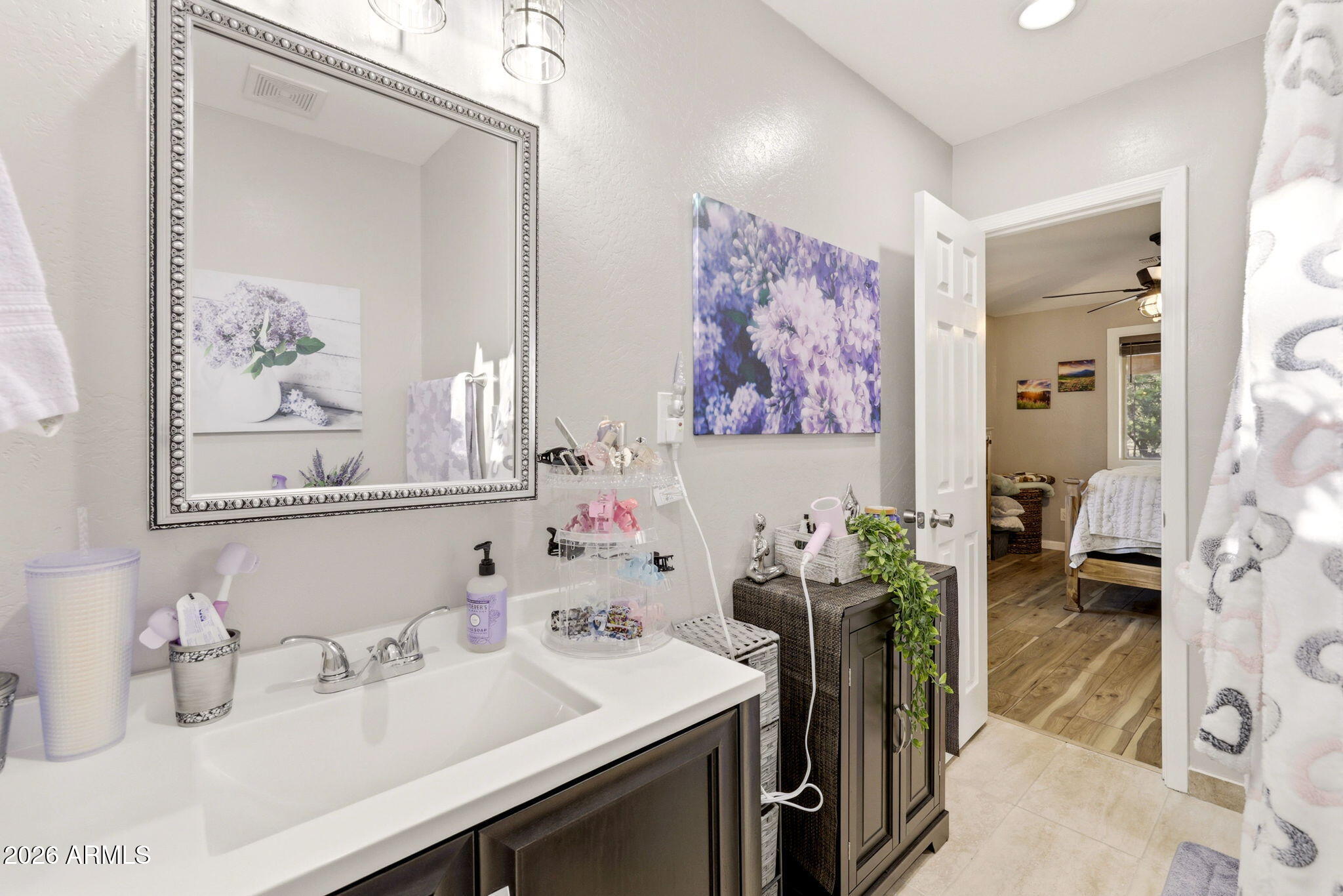 2900 Long Rifle Place Overgaard, AZ 85933 - Photo 14 of 35 a bathroom with a sink mirror and vanity