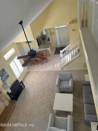 a view of living room with furniture and rug