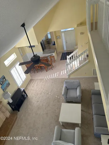 a view of living room with furniture and rug