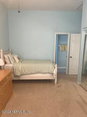 a view of a bedroom with a bed