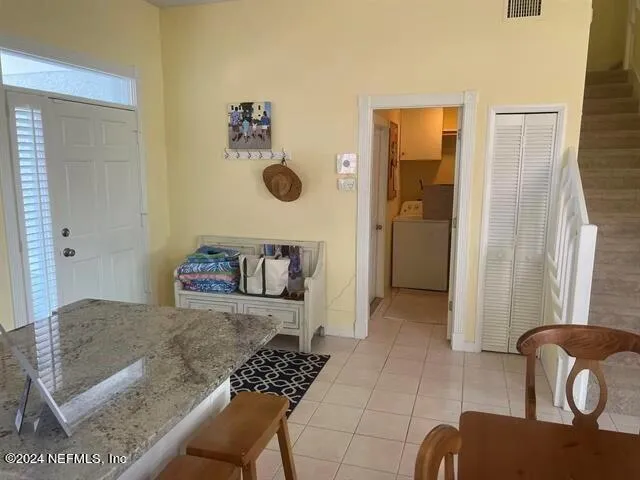 a living room with furniture and a rug