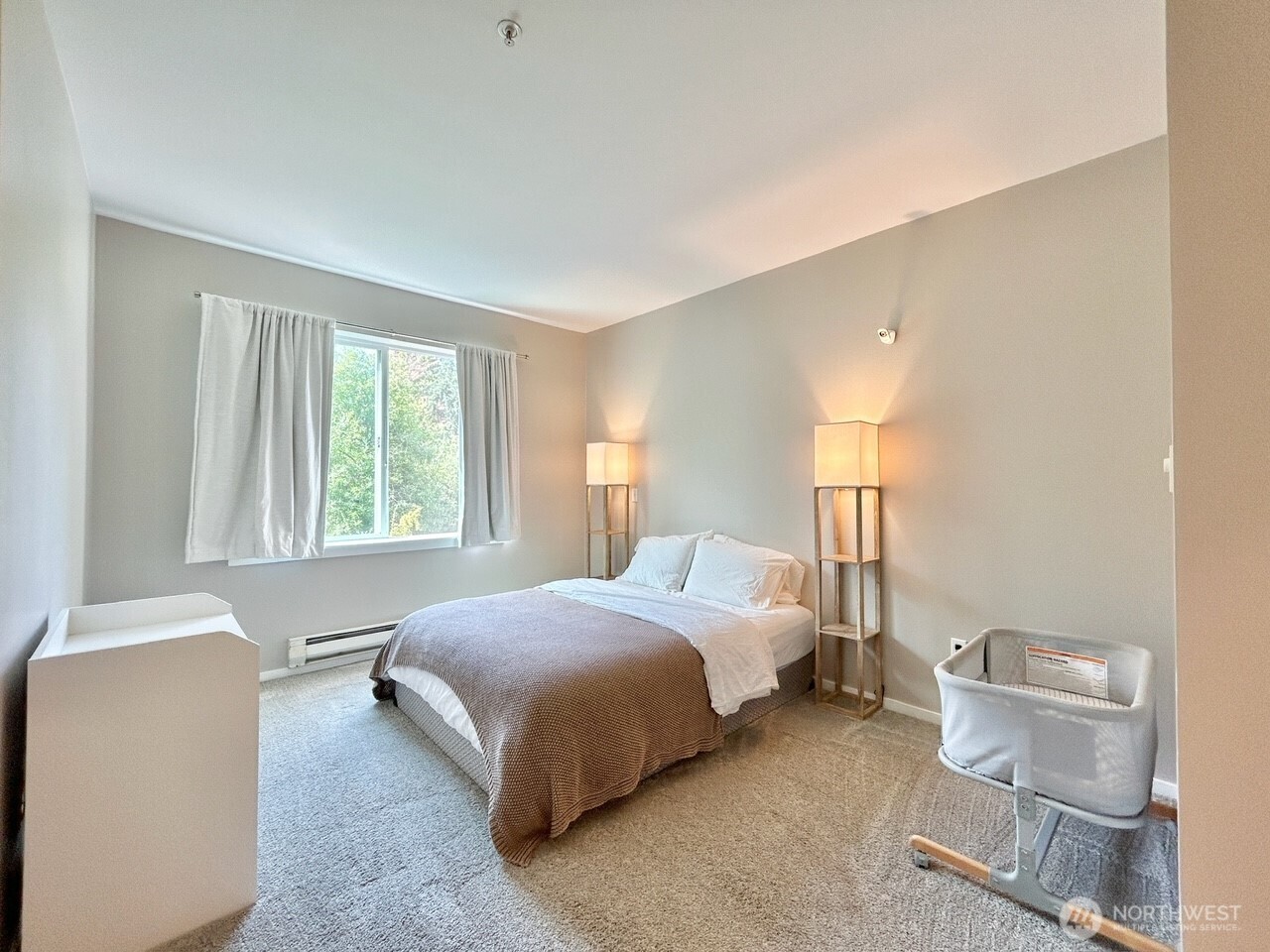 2009 196th Street Southeast, Unit A203 Bothell, WA 98012 - Photo 12 of 19 a bedroom with a bed and a window