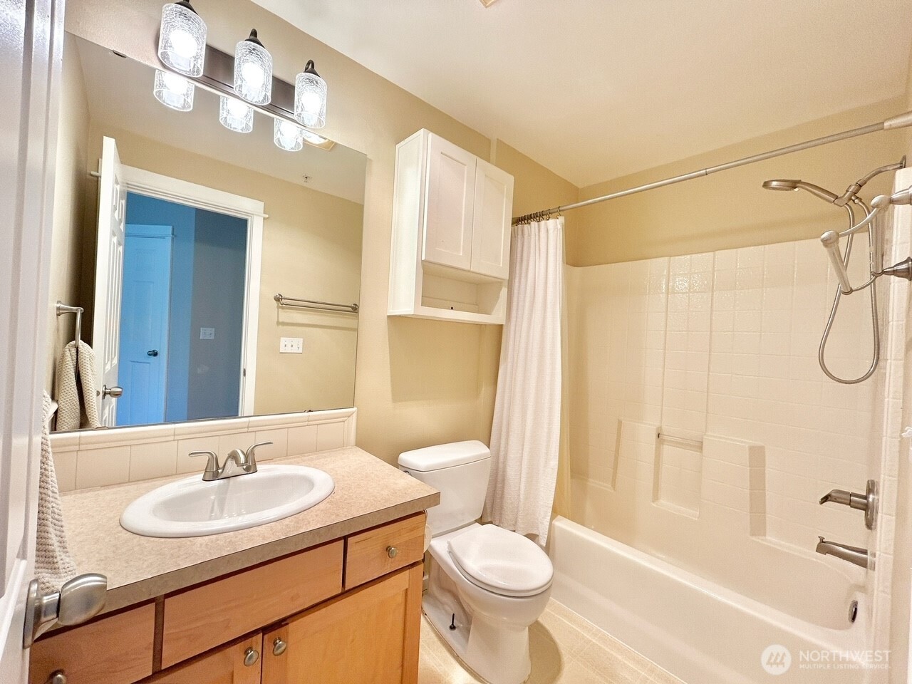 2009 196th Street Southeast, Unit A203 Bothell, WA 98012 - Photo 14 of 19 a bathroom with a sink toilet a mirror and shower