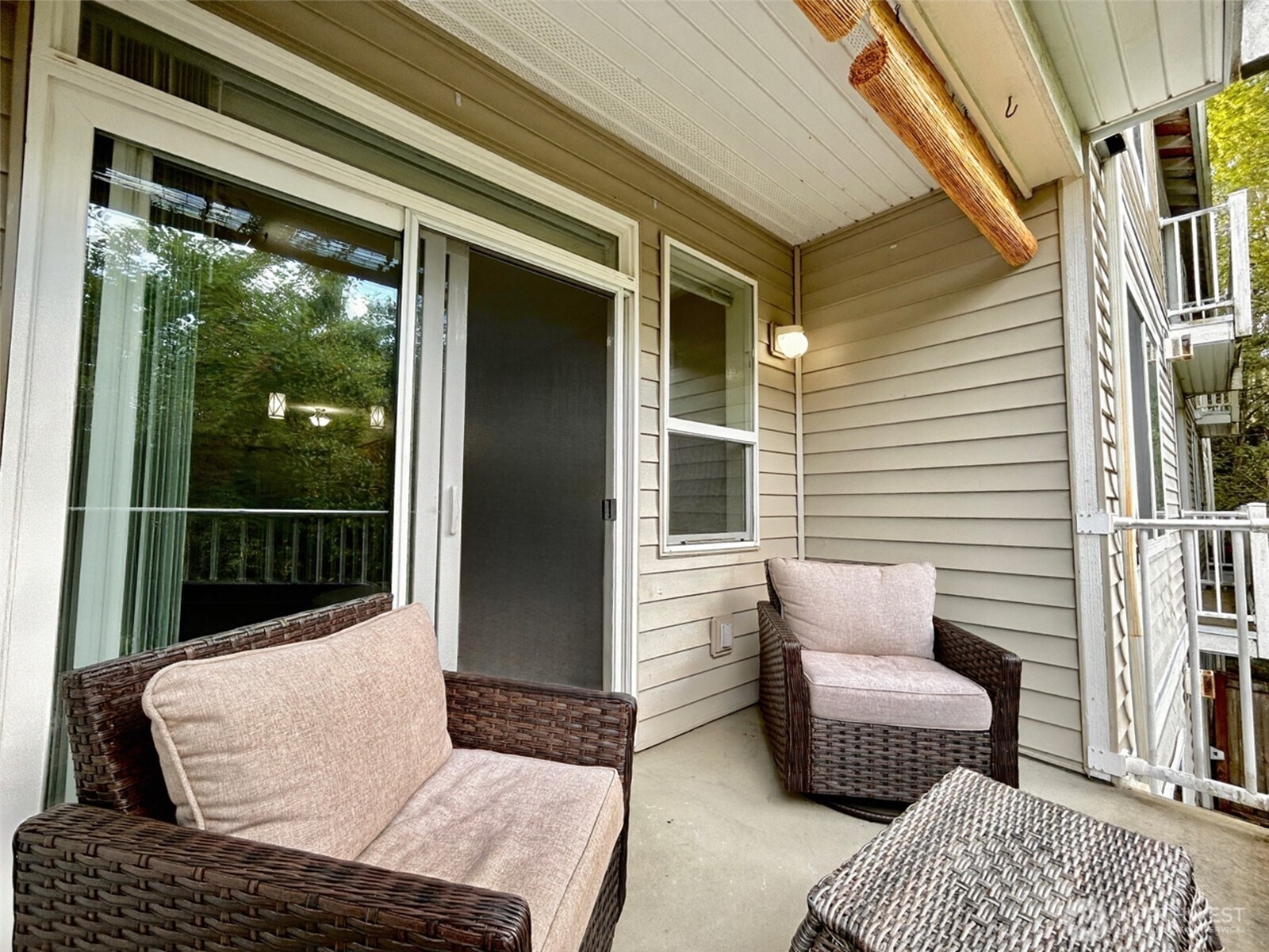 2009 196th Street Southeast, Unit A203 Bothell, WA 98012 - Photo 17 of 19 a balcony with furniture and a potted plant