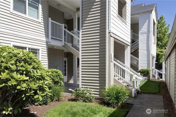 2009 196th Street Southeast, Unit A203 Bothell, WA 98012 - Photo 19 of 19 a view of a house with a yard and plants