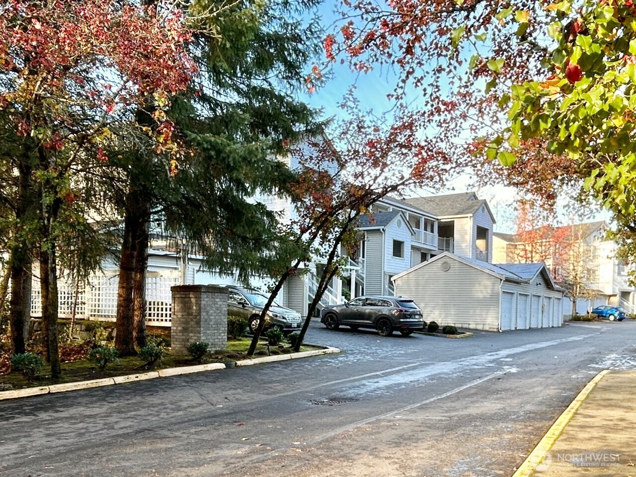 2009 196th Street Southeast, Unit A203 Bothell, WA 98012 - Photo 2 of 19 a white house that has a tree in front of it