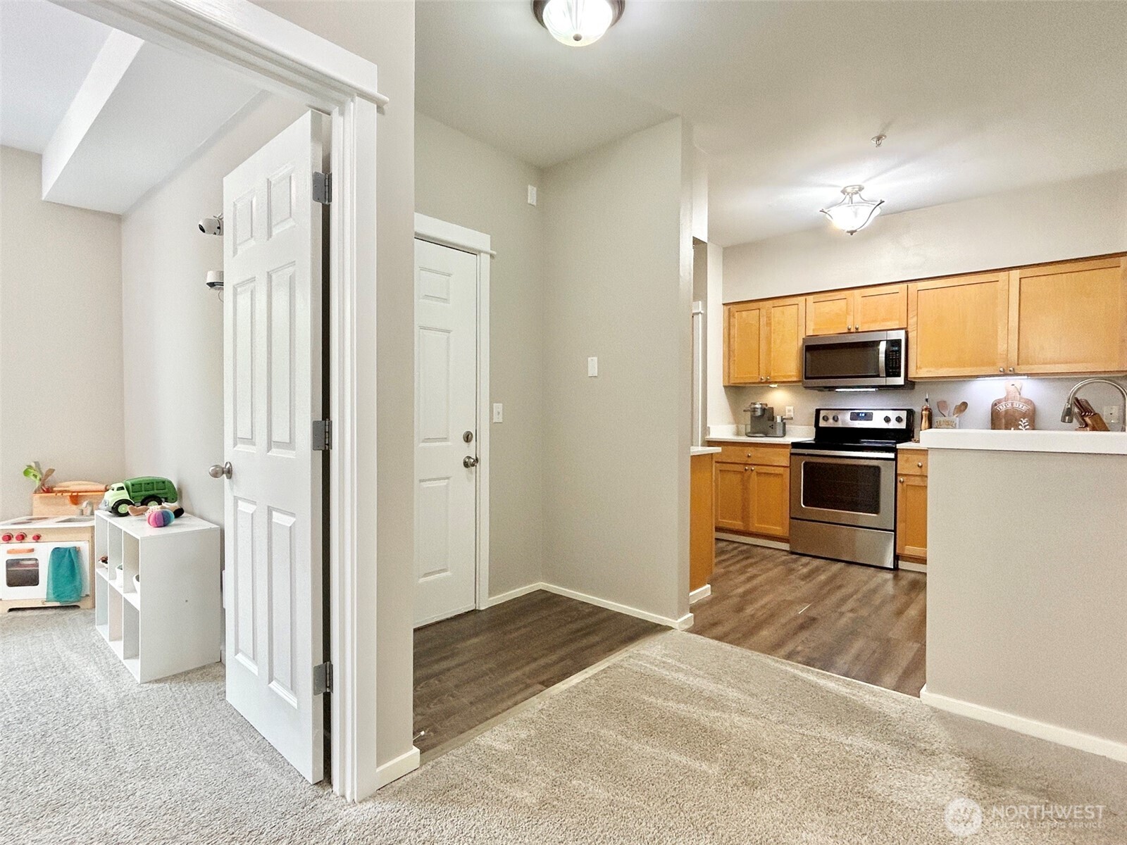 2009 196th Street Southeast, Unit A203 Bothell, WA 98012 - Photo 4 of 19 a kitchen with a refrigerator and a sink