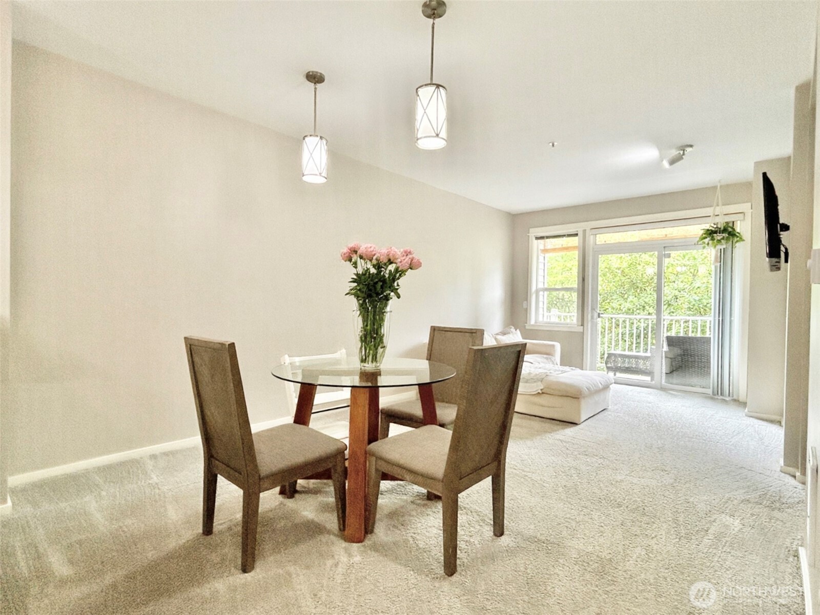 2009 196th Street Southeast, Unit A203 Bothell, WA 98012 - Photo 8 of 19 a dining room with furniture a chandelier and wooden floor
