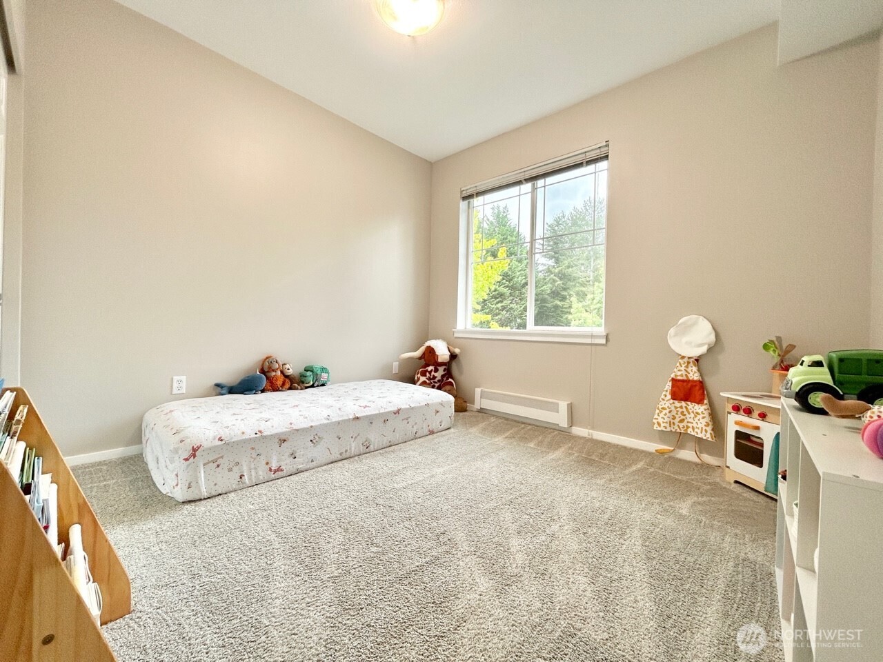 2009 196th Street Southeast, Unit A203 Bothell, WA 98012 - Photo 10 of 19 a bedroom with a bed and a window
