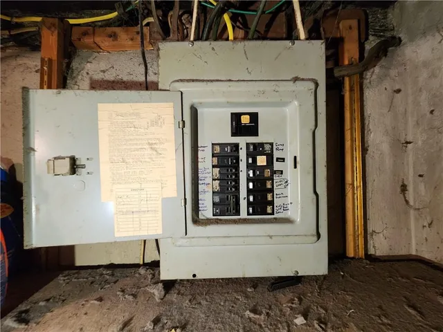 a front view of a house with large windows