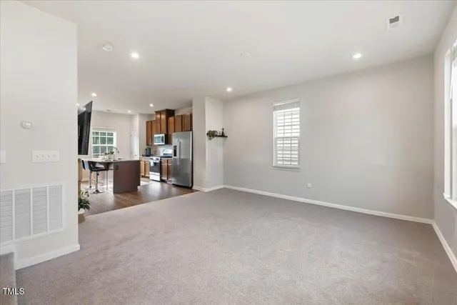 a bathroom with a toilet a sink and a window