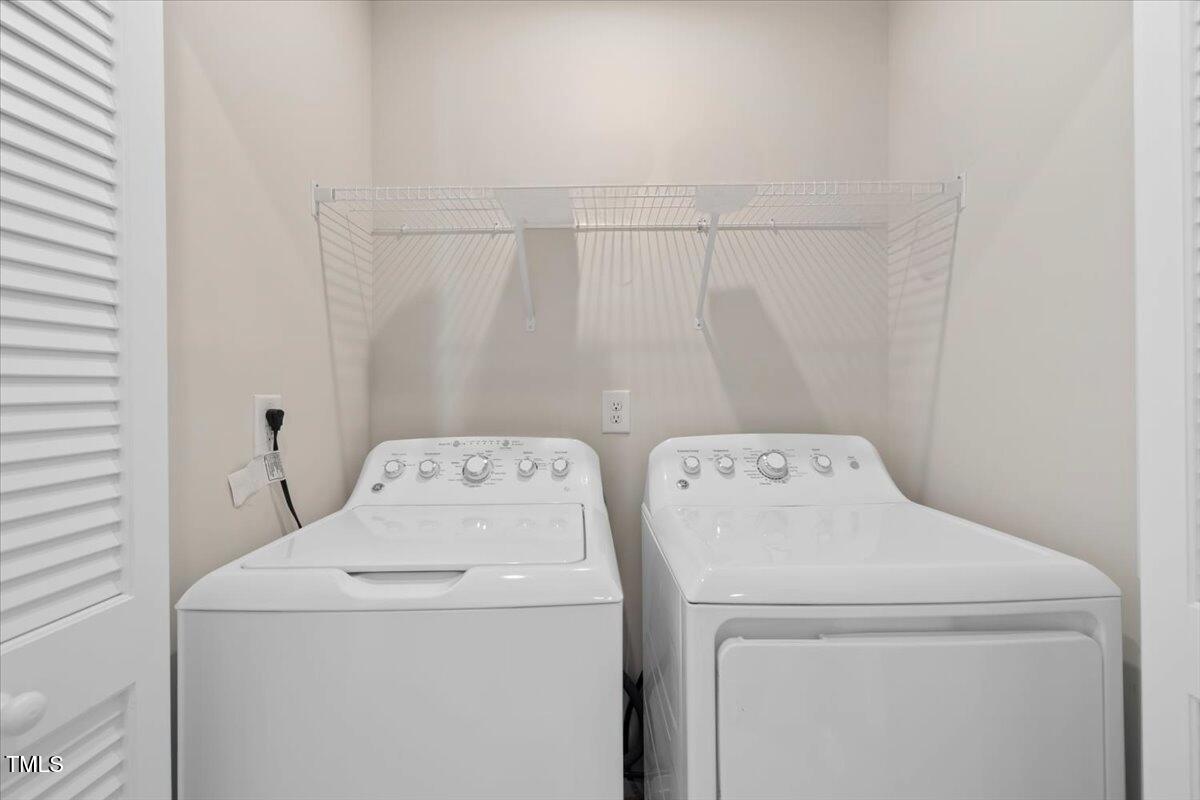 6620 Pathfinder Way Raleigh, NC 27616 - Photo 27 of 39 a utility room with dryer and washer