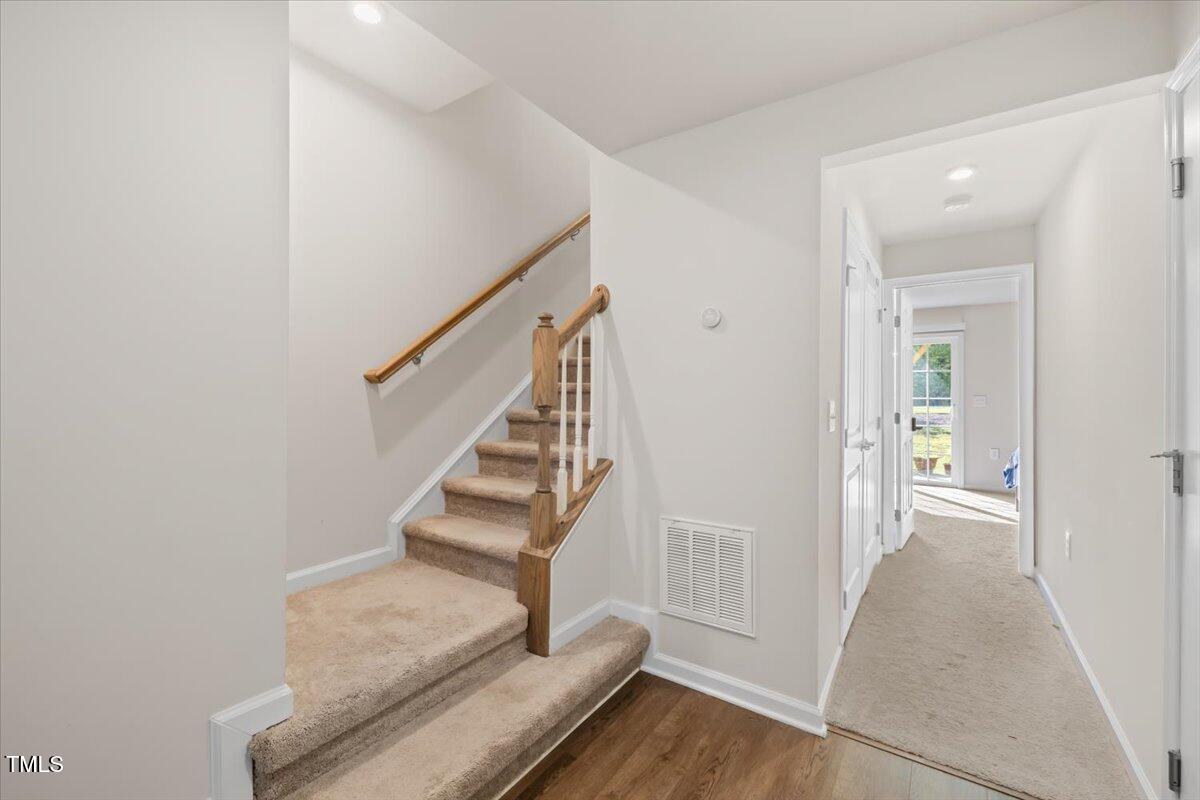 6620 Pathfinder Way Raleigh, NC 27616 - Photo 6 of 39 a view of entryway with wooden floor and stairs
