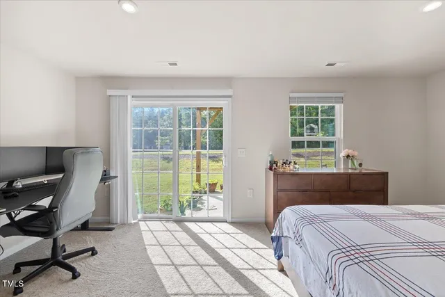 a bedroom with a bed and a desk