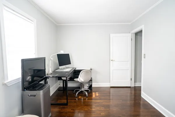 a workspace with furniture and wooden floor