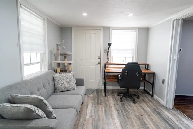 a living room with furniture and a window